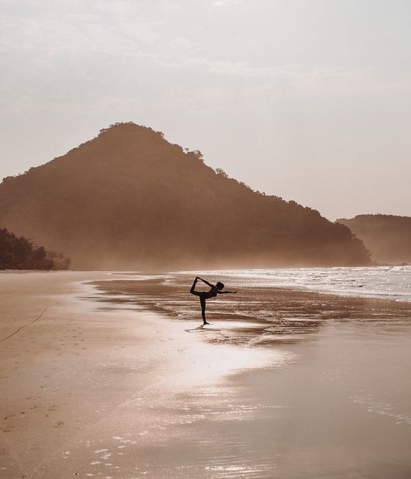 A woman in a serene yoga pose, embodying balance and focus.